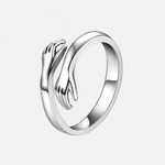 Hug Ring in Silver with sculpted embrace design